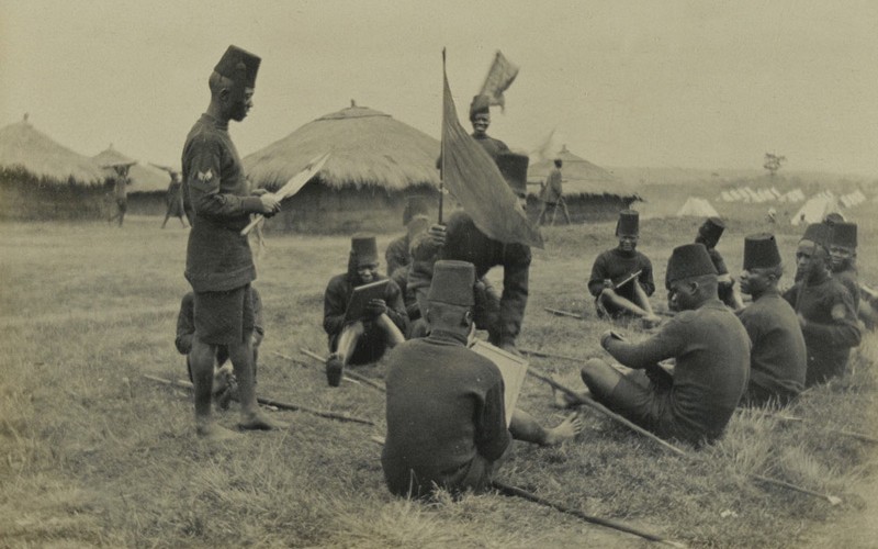 Soldiers of the King’s African Rifles undergo instruction in the use of signalling flags, 1916