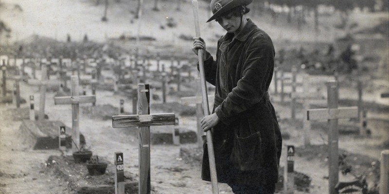 A member of the Women's Army Auxiliary Corps in a graveyard at Étaples, France, 1918