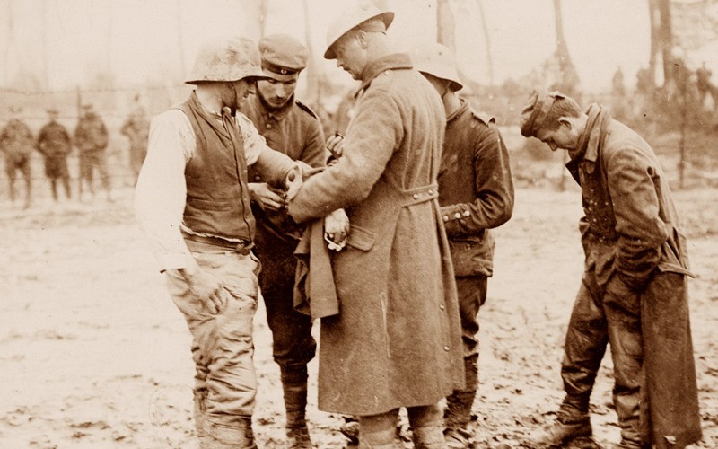 Treating a wounded German prisoner near Langemarck, 26 September 1917