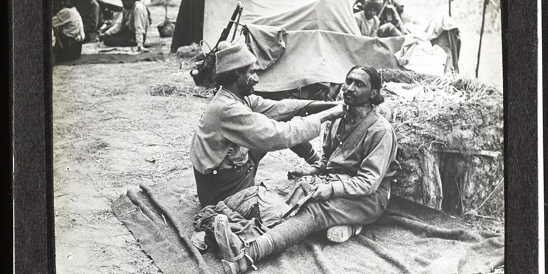 An Indian barber goes to work at the Indian Cavalry camp near Querrieu, located on the Albert-Amiens road, 29 July 1916