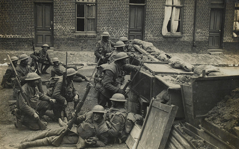 Soldiers from The Duke of Cambridge's Own (Middlesex Regiment) at a street barricade, Spring 1918