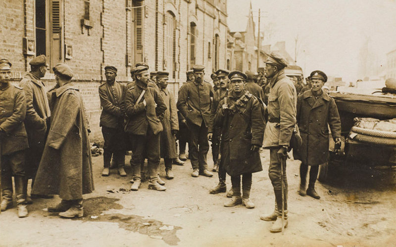 'The German offensive. German prisoners resting in a small village', 1918